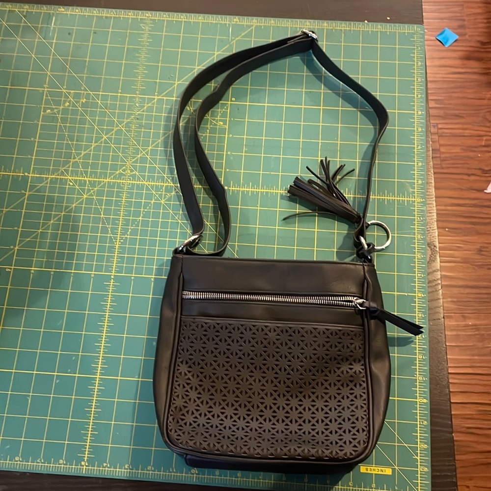 Black crossbody with laser cut detail